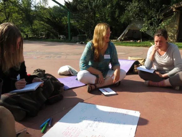 People sitting during a permaculture course